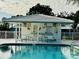 Community pool with covered seating and tables at 7315 8Th W Ave, Bradenton, FL 34209