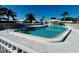 Community pool with lounge chairs and a shaded area at 7315 8Th W Ave, Bradenton, FL 34209