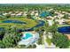 Aerial view of community with lake and homes at 5200 Highbury Cir, Sarasota, FL 34238