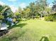 Spacious backyard with lush landscaping and a patio area at 5200 Highbury Cir, Sarasota, FL 34238