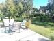 Spacious backyard with patio furniture and lush landscaping at 5200 Highbury Cir, Sarasota, FL 34238