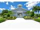 Community clubhouse with walkway and landscaping at 5200 Highbury Cir, Sarasota, FL 34238