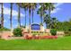 The Hamptons at Palmer Ranch community entrance with lush landscaping at 5200 Highbury Cir, Sarasota, FL 34238