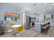 Eat-in kitchen with stainless steel appliances and yellow chairs at 5200 Highbury Cir, Sarasota, FL 34238