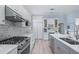 Updated kitchen featuring stainless steel appliances and gray cabinetry at 5200 Highbury Cir, Sarasota, FL 34238