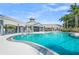 Community pool with lounge chairs and covered seating at 5200 Highbury Cir, Sarasota, FL 34238