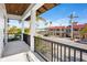 Private balcony overlooking a tree-lined street and local businesses at 551 S Washington Dr, Sarasota, FL 34236