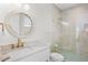 Clean bathroom with a walk-in shower and marble vanity at 551 S Washington Dr, Sarasota, FL 34236