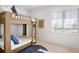 Charming bedroom with a wooden bunk bed and blue accents at 551 S Washington Dr, Sarasota, FL 34236