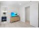 Light and bright bedroom with TV and built-in dresser at 551 S Washington Dr, Sarasota, FL 34236