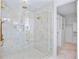 Spa-like shower with marble tile and glass enclosure at 551 S Washington Dr, Sarasota, FL 34236