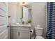 Modern bathroom with granite countertop, updated vanity, and stylish shower at 5554 Sand Fossil Ct, Sarasota, FL 34238