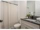 Clean bathroom with a single vanity and neutral decor at 5554 Sand Fossil Ct, Sarasota, FL 34238