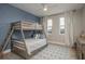 Cozy bedroom with a built-in bunk bed and stylish decor at 5554 Sand Fossil Ct, Sarasota, FL 34238