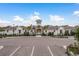 Community clubhouse with parking and landscaping at 5554 Sand Fossil Ct, Sarasota, FL 34238