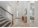 Light-filled entryway with hardwood floors and view into living area at 5554 Sand Fossil Ct, Sarasota, FL 34238