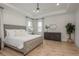 Luxurious main bedroom with plush bed and plenty of space at 5554 Sand Fossil Ct, Sarasota, FL 34238