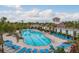 Community pool with lounge chairs and cabana at 5554 Sand Fossil Ct, Sarasota, FL 34238