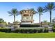 Community entrance with fountain and landscaping at 5987 Snowy Egret Dr, Sarasota, FL 34238