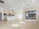 Open concept living area with kitchen and sliding doors at 5987 Snowy Egret Dr, Sarasota, FL 34238