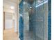 Large walk-in shower with blue mosaic tile at 5987 Snowy Egret Dr, Sarasota, FL 34238