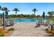 Resort-style pool with lounge chairs and umbrellas at 5987 Snowy Egret Dr, Sarasota, FL 34238