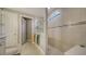 Spa-like bathroom with a large walk-in shower and neutral tile at 6839 Chester Trl, Bradenton, FL 34202