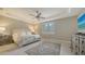 Bright and airy bedroom with a ceiling fan and large windows at 6839 Chester Trl, Bradenton, FL 34202