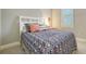 Bedroom with a floral comforter and pillows at 6839 Chester Trl, Bradenton, FL 34202