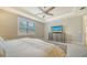 Main bedroom with a ceiling fan, large windows, and ample space at 6839 Chester Trl, Bradenton, FL 34202