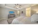 Main bedroom with ensuite access, featuring a ceiling fan and plenty of natural light at 6839 Chester Trl, Bradenton, FL 34202