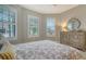 Bright bedroom with a dresser and window shutters at 6839 Chester Trl, Bradenton, FL 34202