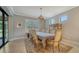 Formal dining room featuring a large table and elegant chandelier at 6839 Chester Trl, Bradenton, FL 34202