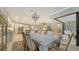 Bright dining room with a large table and access to kitchen at 6839 Chester Trl, Bradenton, FL 34202