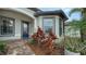 Front entry with blue door and brick walkway at 6839 Chester Trl, Bradenton, FL 34202