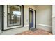 Front entry with blue door and brick walkway at 6839 Chester Trl, Bradenton, FL 34202