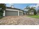 Two-car garage with brick paver driveway at 6839 Chester Trl, Bradenton, FL 34202
