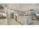 Modern kitchen features a large island, stainless steel appliances, and ample counter space at 6839 Chester Trl, Bradenton, FL 34202