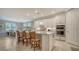 Spacious kitchen with island, stainless steel appliances, and white cabinetry at 6839 Chester Trl, Bradenton, FL 34202