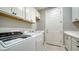 Laundry room with washer, dryer, and cabinets at 6839 Chester Trl, Bradenton, FL 34202