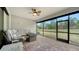 Relaxing screened patio with seating area overlooking the backyard at 6839 Chester Trl, Bradenton, FL 34202
