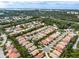 Aerial view of a neighborhood with houses and green spaces at 9143 Willow Brook Dr, Sarasota, FL 34238