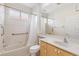 Bathroom with tub, shower, and light wood cabinets at 9143 Willow Brook Dr, Sarasota, FL 34238