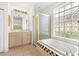 Bathroom with shower/tub combo, tiled floor and vanity at 9143 Willow Brook Dr, Sarasota, FL 34238