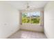 Bright bedroom with large window and ceiling fan at 9143 Willow Brook Dr, Sarasota, FL 34238