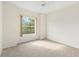 Bright bedroom with large window and carpeted floor at 9143 Willow Brook Dr, Sarasota, FL 34238