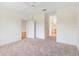 Spacious bedroom with carpeted floor and ceiling fan at 9143 Willow Brook Dr, Sarasota, FL 34238