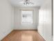 Bedroom with wood floors, window and built-in shelving at 9143 Willow Brook Dr, Sarasota, FL 34238