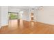 Bright dining room with hardwood floors and a view into the kitchen at 9143 Willow Brook Dr, Sarasota, FL 34238