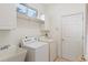 Laundry room with washer, dryer, and utility sink at 9143 Willow Brook Dr, Sarasota, FL 34238